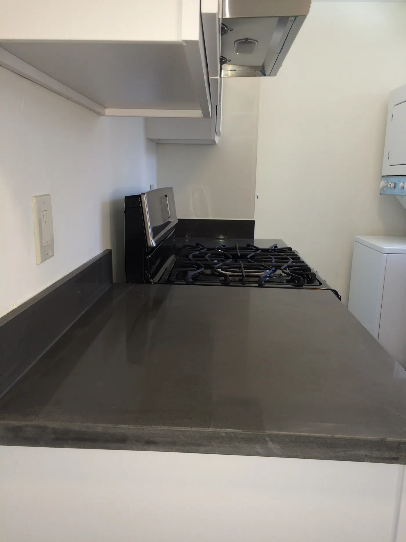 Clean kitchen with spotless countertops, representative of same-day cleaning by White Flowers Cleaning Services