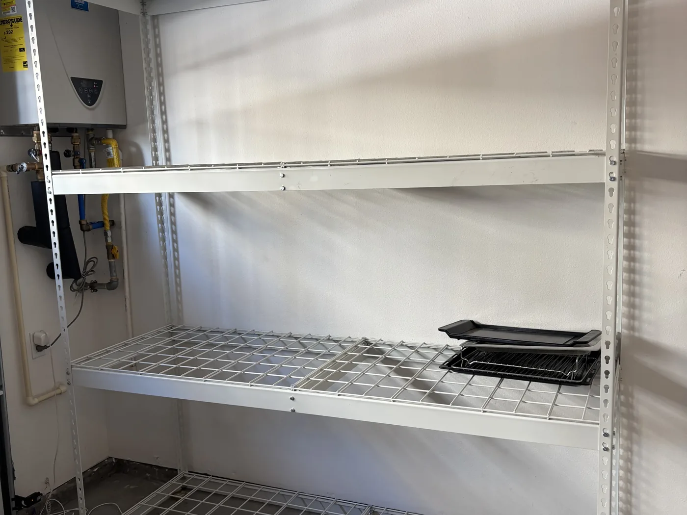 Storage shelving cleared of construction dust and wiped down after a remodel