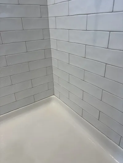 Second view of a cleaned shower corner with a spotless pan